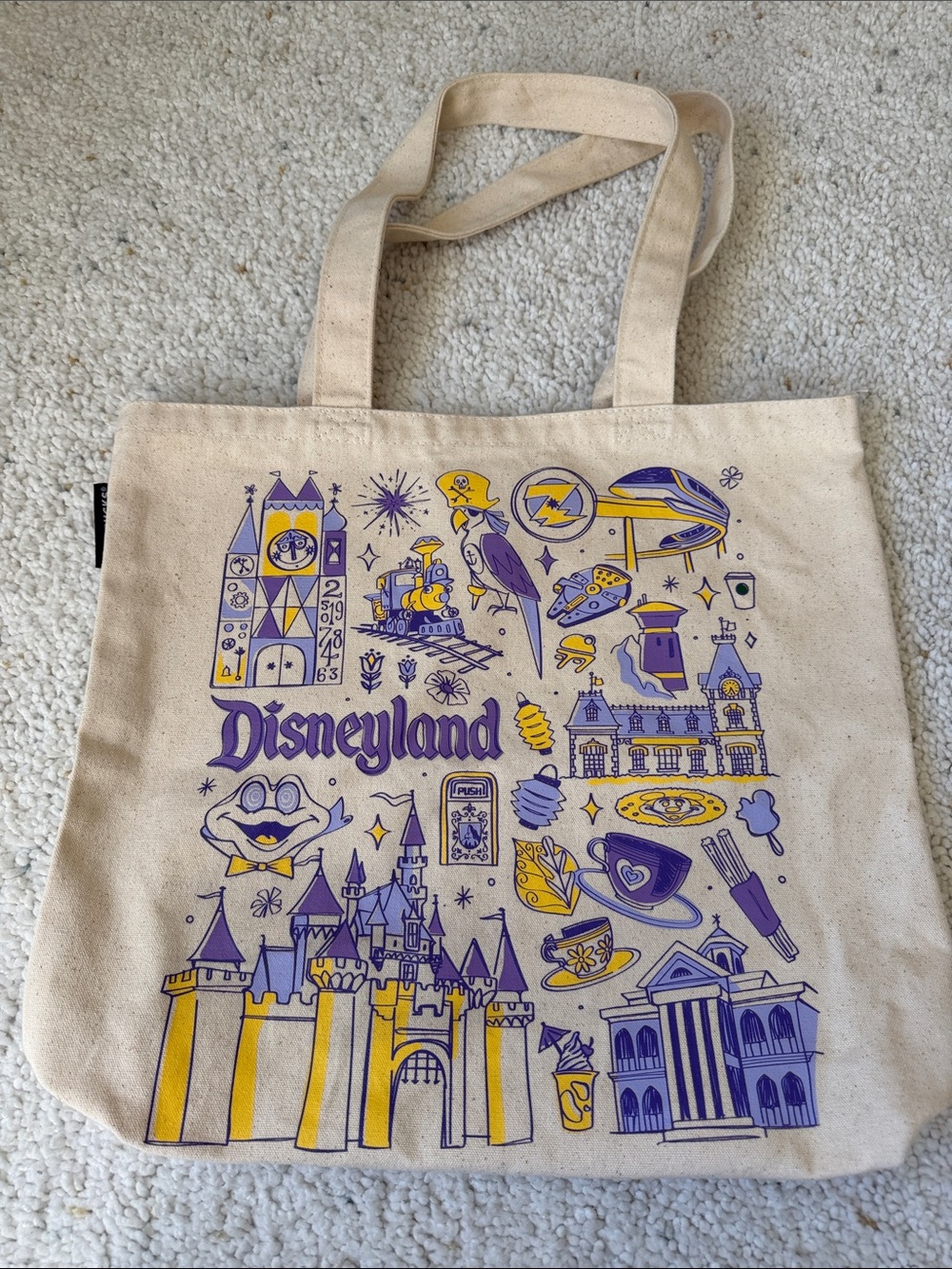 Disneyland X Starbucks Canvas Tote Bag in Cream with Purple & Yellow Graphic